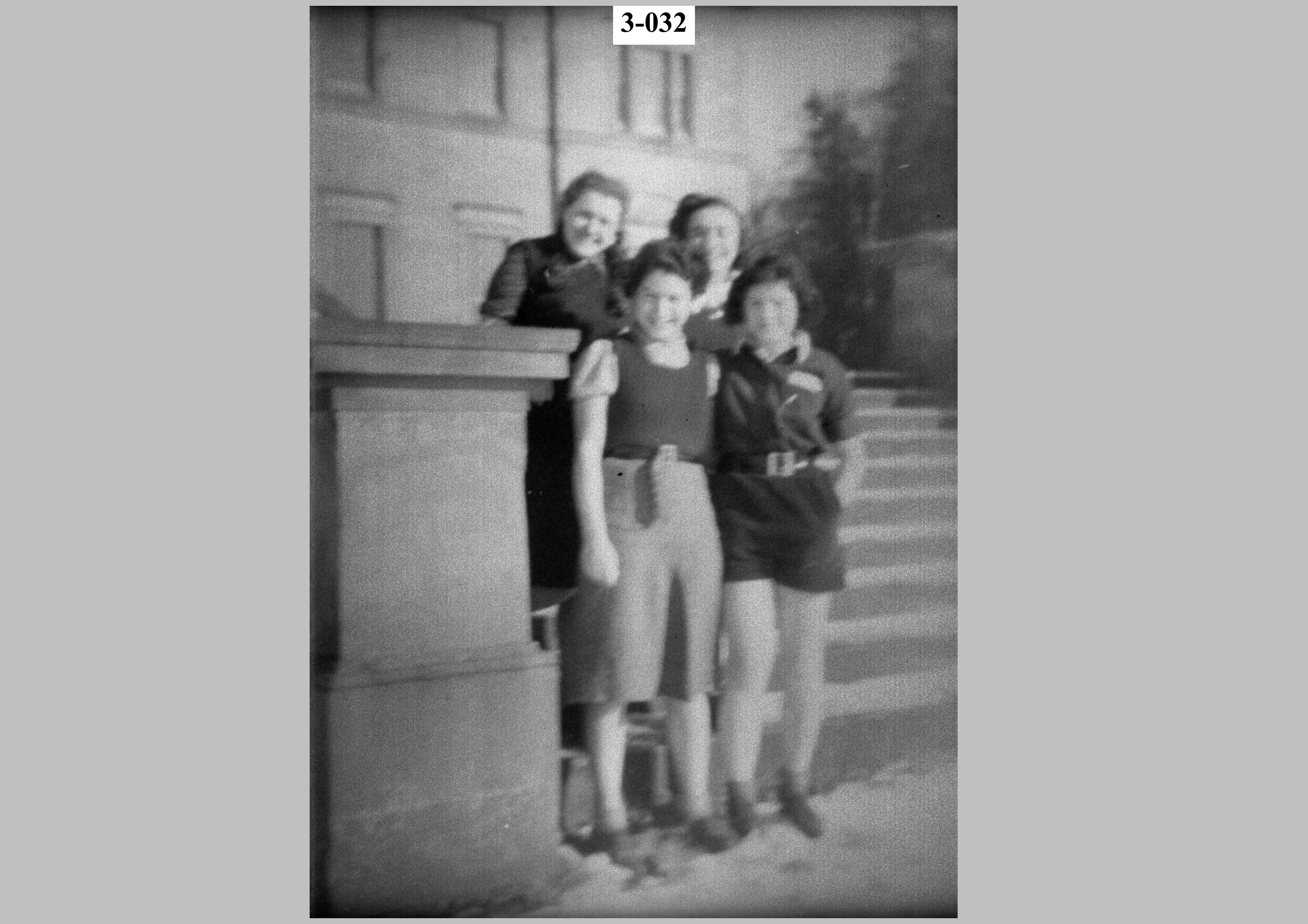 Four girls by a pillar.jpg