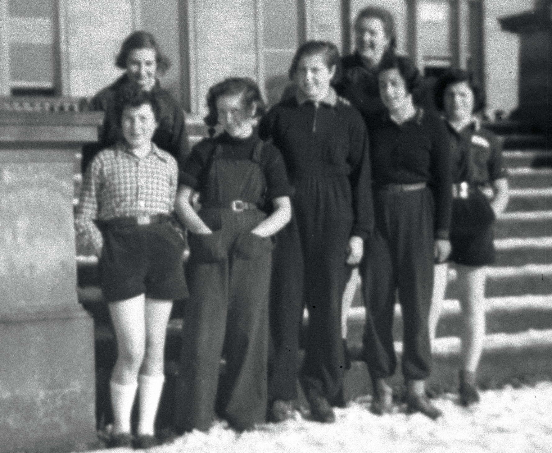 Group of seven girls in the snow.jpg
