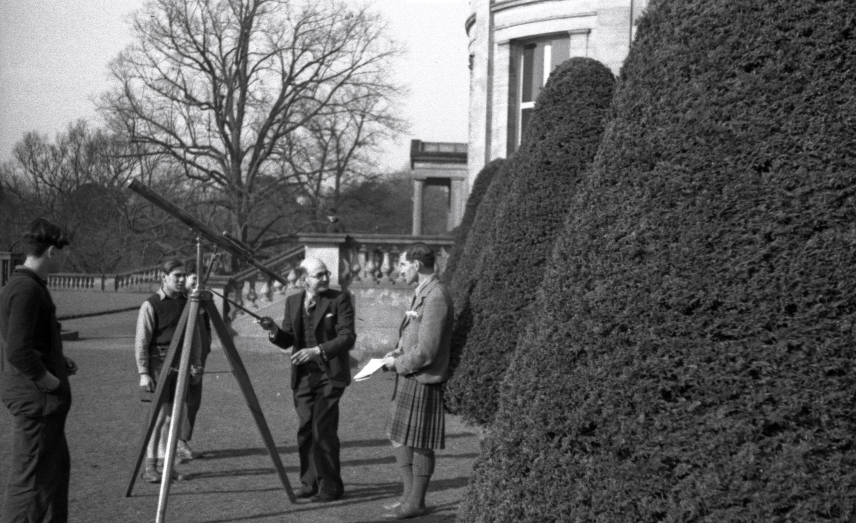 Staff member and the Head try out the telescope.jpg