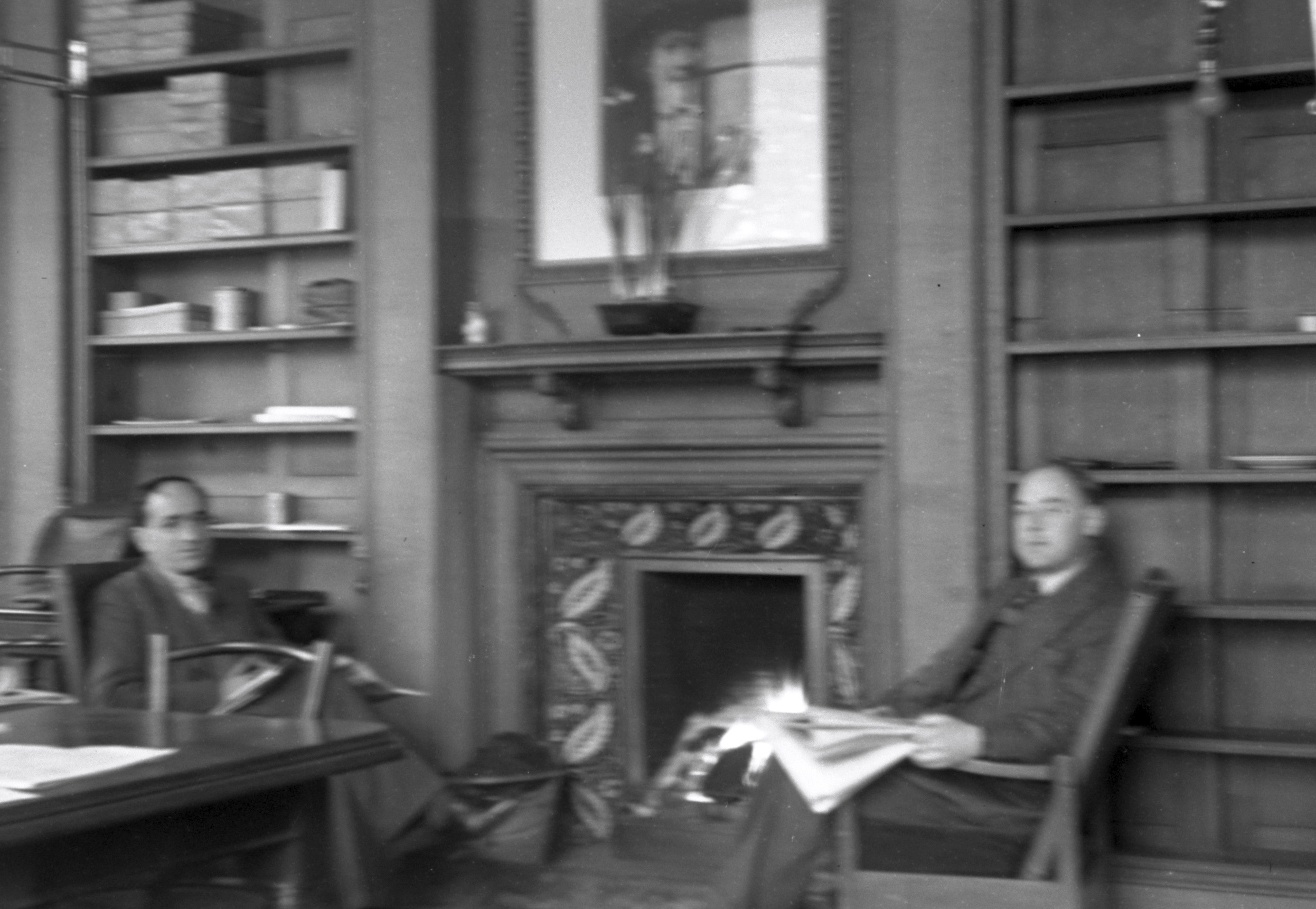 Staffroom, two members of staff relax.jpg