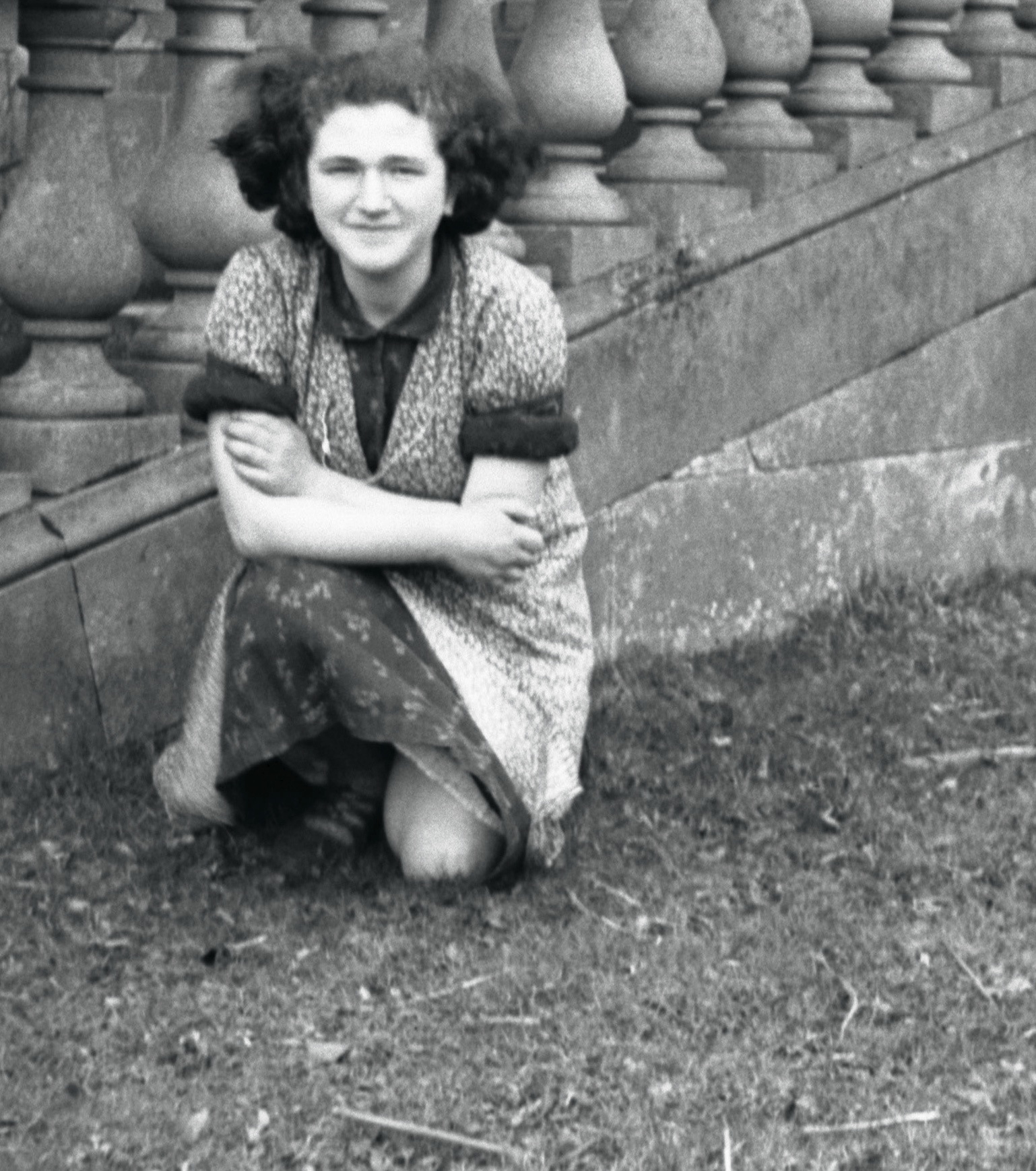 Girl kneeling by steps.jpg