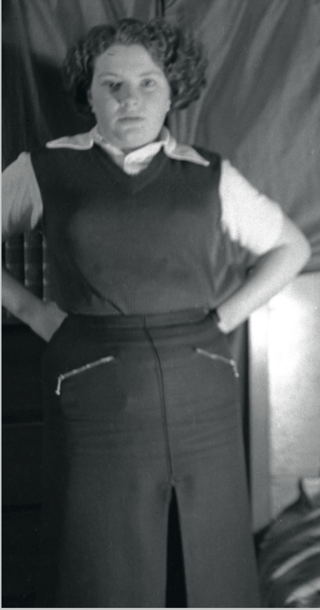 One unknown girl, arms on hips.jpg