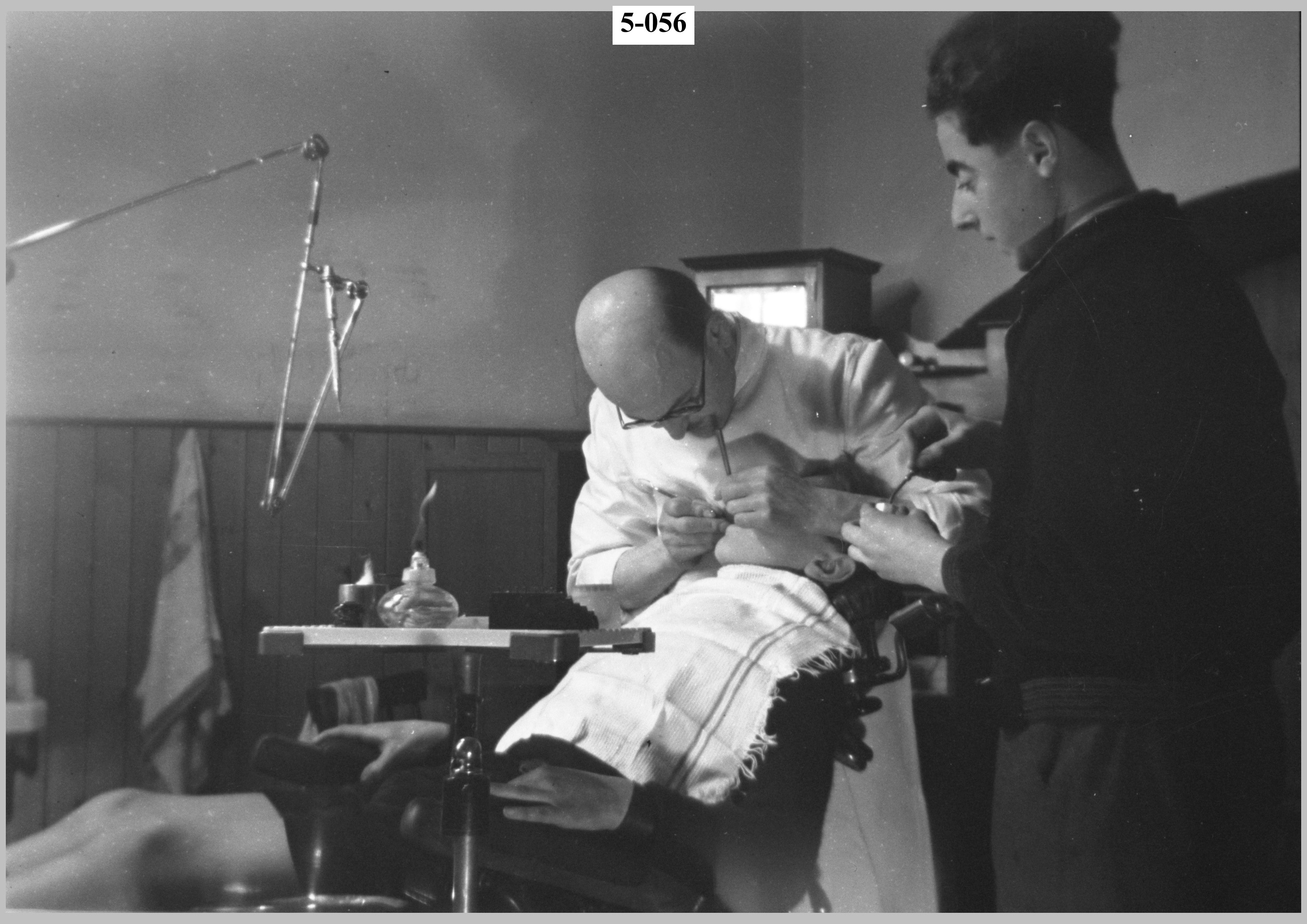 The dentist getting down to the task.jpg