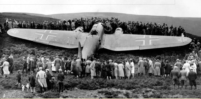 The Kidlaw Heinkel and curious locals.png